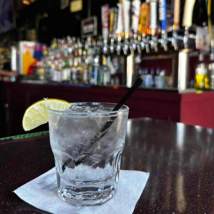 Cocktail with lime at the bar